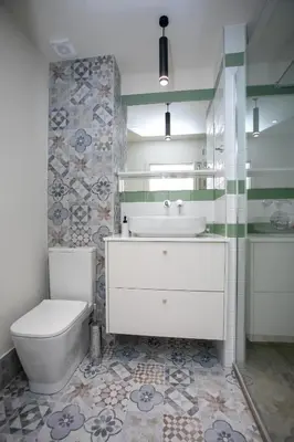 a bathroom with a white toilet and a sink at Palmove Luxurious Beachfront Apt in Larnaka