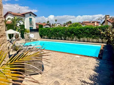 a swimming pool in front of a house at Potamos Villa - Villa Kymma 4 in Ayia Napa