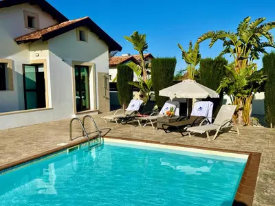 a swimming pool in front of a house at Potamos Villa - Villa Kymma 4 in Ayia Napa