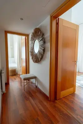 a room with a mirror on the wall and a chair at Stylish & Picturesque Oasis Anthorina 2 in Protaras