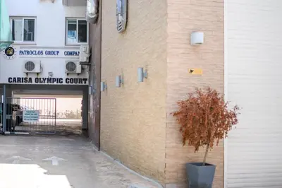 a plant in a pot next to a building at Olympia Flat 104 in Larnaka