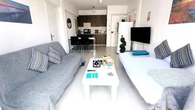 a living room with a couch and a table at SPECIAL OFFER -70 Percent Off - 2 BR - Sleep 7 - Best Location at Ayia Napa City Center in Ayia Napa