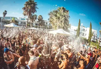 a large group of people playing in the water at SPECIAL OFFER -70 Percent Off - 2 BR - Sleep 7 - Best Location at Ayia Napa City Center in Ayia Napa