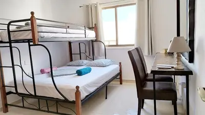 a bedroom with two bunk beds and a desk with a desk at SPECIAL OFFER -70 Percent OFF - Sleep 5 - Best Location - Free Parking in Ayia Napa