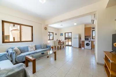 a living room with a couch and a table at Villa Stephanie Oasis in Ayia Napa