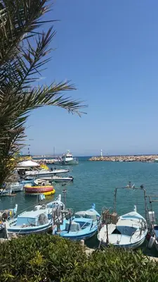 a group of boats are docked in the water at NISSI BEACH Apt 2 RESORT AND SEA VIEW FREE WIFI in Ayia Napa