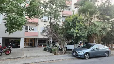 a silver car parked in front of a building at Luxurious Orestis in Limassol