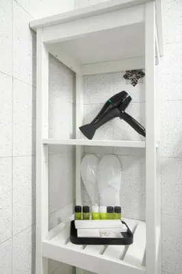 a white shelf with some items on it at Urban Condo 11 - 1 Bdr in Nicosia