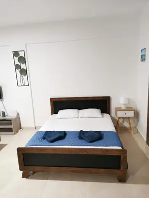 a bedroom with a bed with two towels on it at Must Stay - Finikoudes Studio in Larnaka