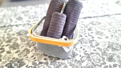 two spools of purple yarn in a case on a table at Stylish Studio - 2 Minutes from Kastella Beach in Larnaka