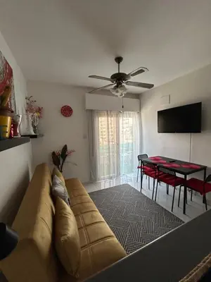 a living room with a couch and a table at Nikoletta apartman in Limassol