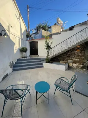 a patio with two chairs and a table at Calavato Cottage in Kalavasos