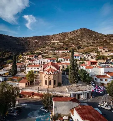 an aerial view of a town with a mountain at Calavato Cottage in Kalavasos