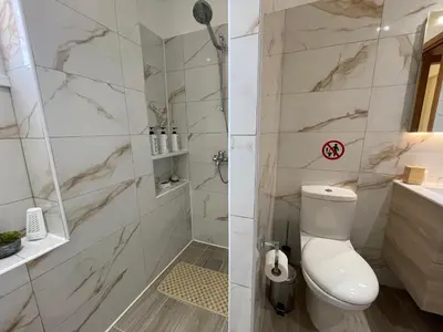 a bathroom with a toilet and a shower at Nissi Beach beautiful apartment in Ayia Napa