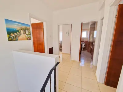a hallway of a house with a painting on the wall at Villa Malama in Paralimni