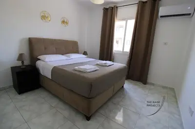a bedroom with a bed with two towels on it at Raise Limassol Coastal City Break in Limassol