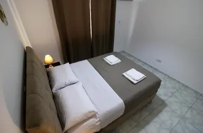 a bedroom with a bed with two towels on it at Raise Limassol Coastal City Break in Limassol