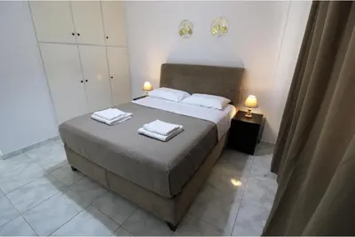 a bedroom with a bed with two towels on it at Raise Limassol Coastal City Break in Limassol