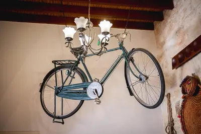 a bike hanging on a wall in a room at Villa To Palati with Private Pool Anogyra in Anoyira