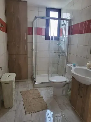a bathroom with a shower and a toilet and a sink at Limassol mountain and sea views in Limassol
