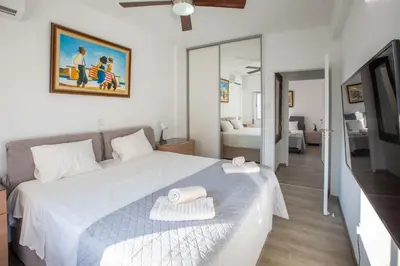 a bedroom with a large bed with two towels on it at Neapolis Residence Spacious Quiet Near beach in Limassol