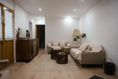 a living room with two couches and a table at Omodos Serenity House in Omodos