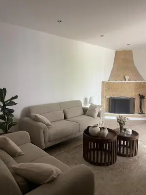 a living room with a couch and a fireplace at Omodos Serenity House in Omodos
