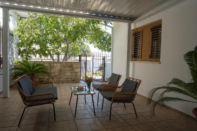 a patio with chairs and a table on a patio at Omodos Serenity House in Omodos