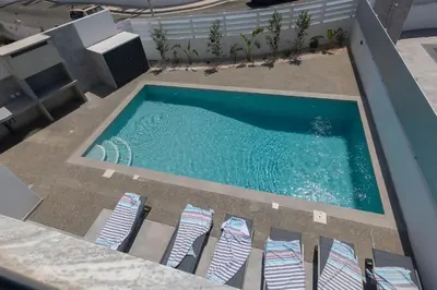 an overhead view of a swimming pool with lounge chairs at Semeli Villa 8 in Protaras