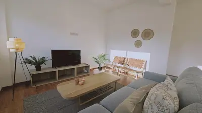 a living room with a couch and a tv at STAY City Life Apartment II in Nicosia