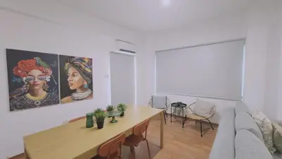 a living room with a table and a couch at STAY City Life Apartment II in Nicosia