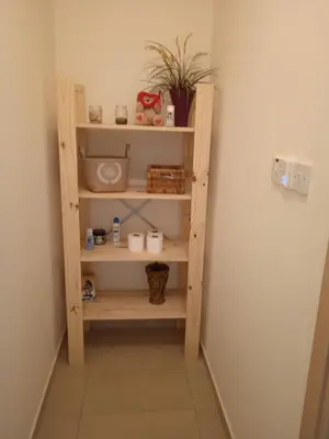 a book shelf in a corner of a room at Xylophagou Rest and Relax 4 Top floor Big Balcony 1 bedroom apartment in Xylophaghou