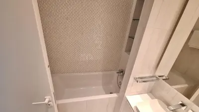 a white bathroom with a shower and a toilet at Del Mar 2 Bedroom Deluxe Seaside 'A' Residence in Limassol