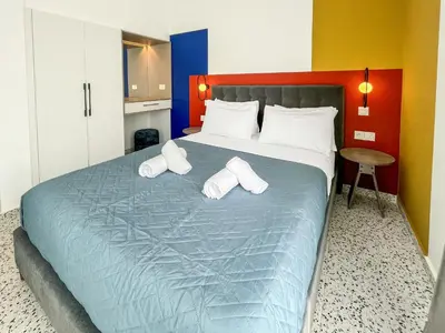 a bedroom with a bed with two pillows on it at Terrazzo style 2 bedroom 2bathroom Apartment in Larnaka