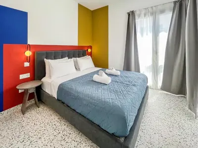 a bedroom with a bed with two towels on it at Terrazzo style 2 bedroom 2bathroom Apartment in Larnaka