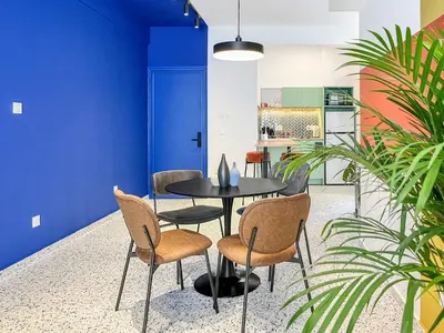 a dining room with a table and chairs at Terrazzo style 2 bedroom 2bathroom Apartment in Larnaka