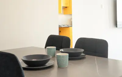 a table with bowls and cups on top of it at Maestro Sunrise View in Larnaka