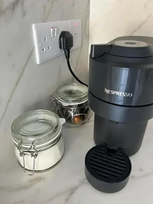 a coffee maker sitting on a counter next to jars at Limassol Urban Beach Retreat- 500m from the beach in Limassol