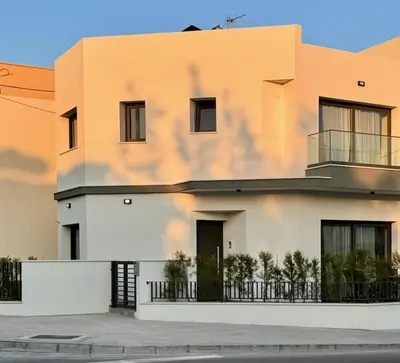 a house with a shadow on the side of it at Limassol Urban Beach Retreat- 500m from the beach in Limassol