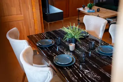 a table with blue plates and a plant on it at Ktima To Alliotiko - Lofou 1 in Lofou