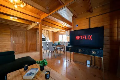 a living room with a nittisk sign on the wall at Ktima To Alliotiko - Lofou 1 in Lofou