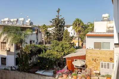 an overhead view of a city with buildings and trees at Agia Napa three bedroom modern flat in Ayia Napa