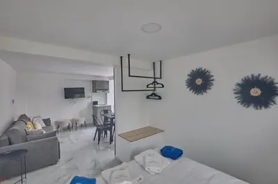 a living room with a couch and a dining room at Gold Emerging Villas Ltd Apart 1 in Ayia Napa
