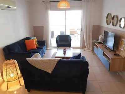 a living room with two couches and a television at Yippee! at Ermou Square Amazing Location View in Larnaka