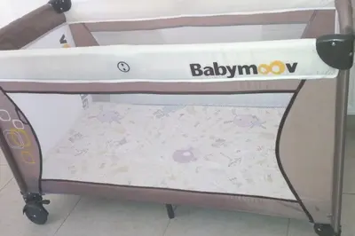 a bed with a crib with at Ivory Suite at Polyxenia - Tourism licence 03125 in Protaras