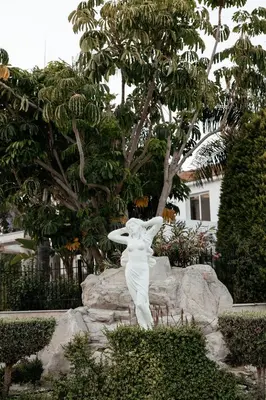 a statue of a angel sitting on a rock at Leah's Deluxe Villa in Tersephanou