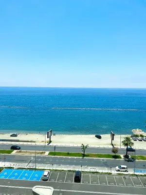 a view of a road and a beach with the ocean at Del Mar 2 Luxe Bedroom 'C' Highrise Residence in Limassol