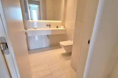 a bathroom with a sink and a toilet at Del Mar 2 Luxe Bedroom 'C' Highrise Residence in Limassol