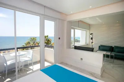 a living room with a view of the ocean at Les Palmiers Sunorama Beach Apartments in Larnaka