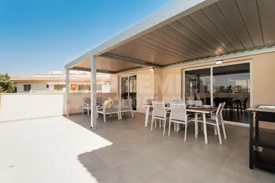 a patio with a table and chairs on a balcony at Apartment Anabelle in Paralimni